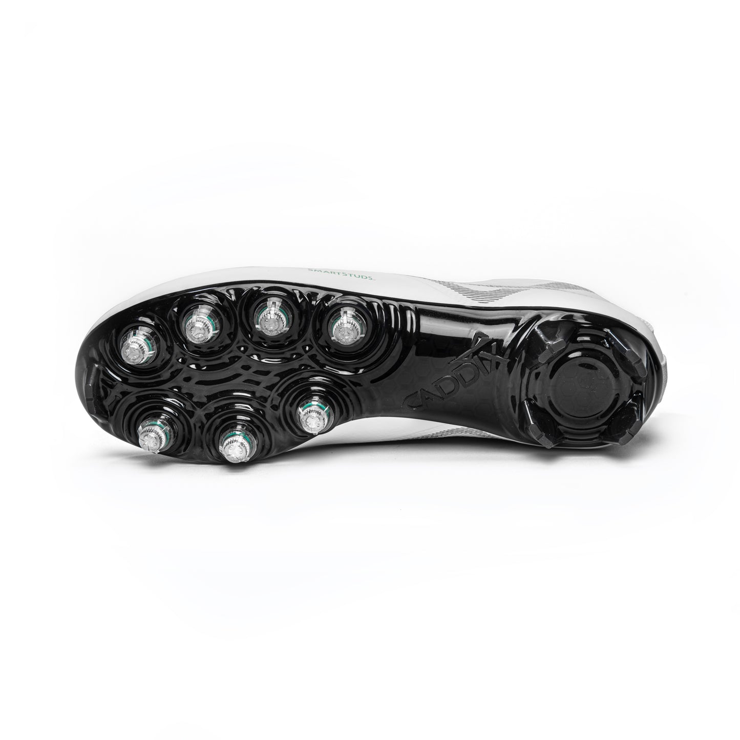 Bottom view of Caddix men’s white/black low football and lacrosse cleats sole featuring Smart Studs that reduce ACL strain