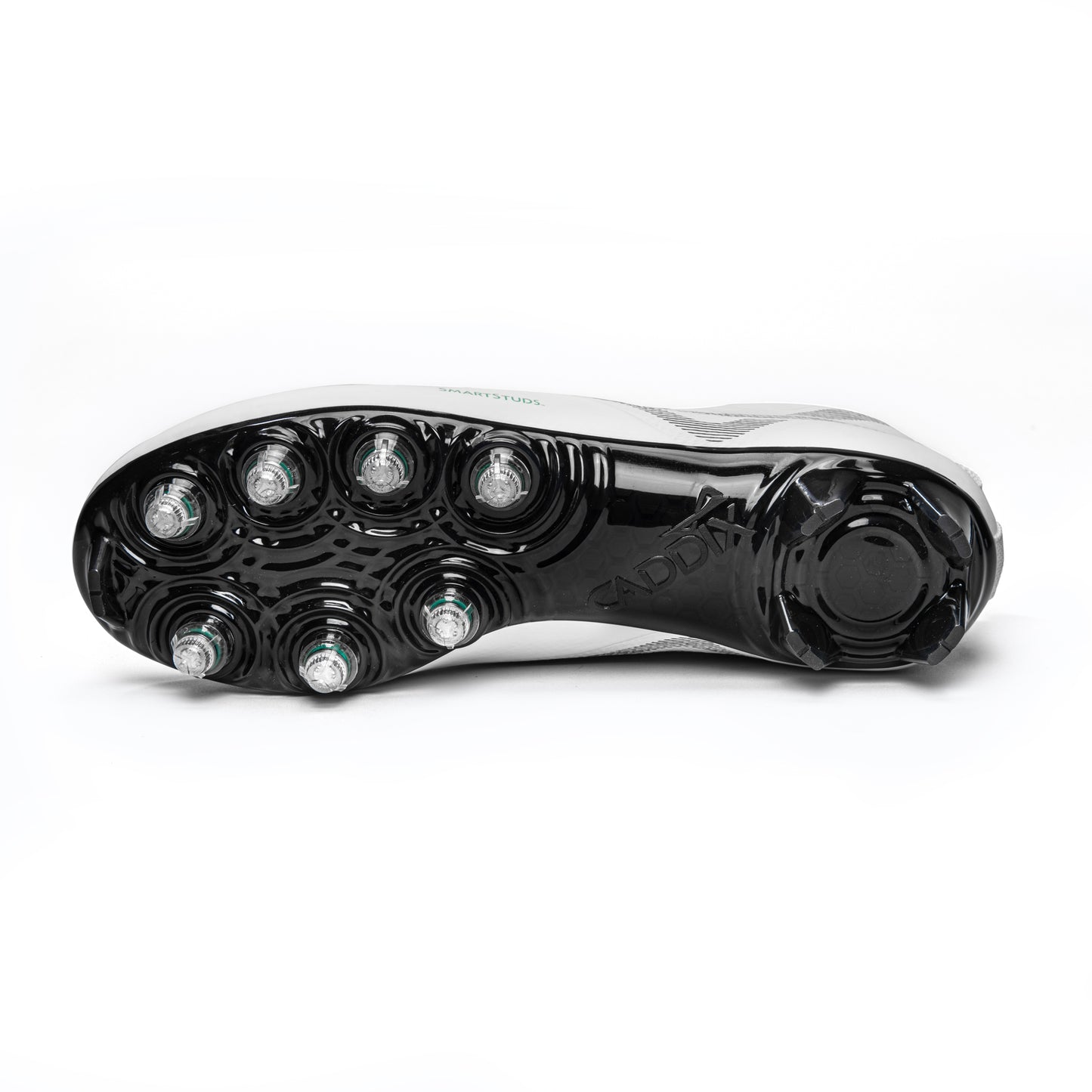 Photo of bottom of white/black Caddix mid men’s football and lacrosse cleats highlighting 7 patented Smart Studs that are proven to reduce ACL tearing torque