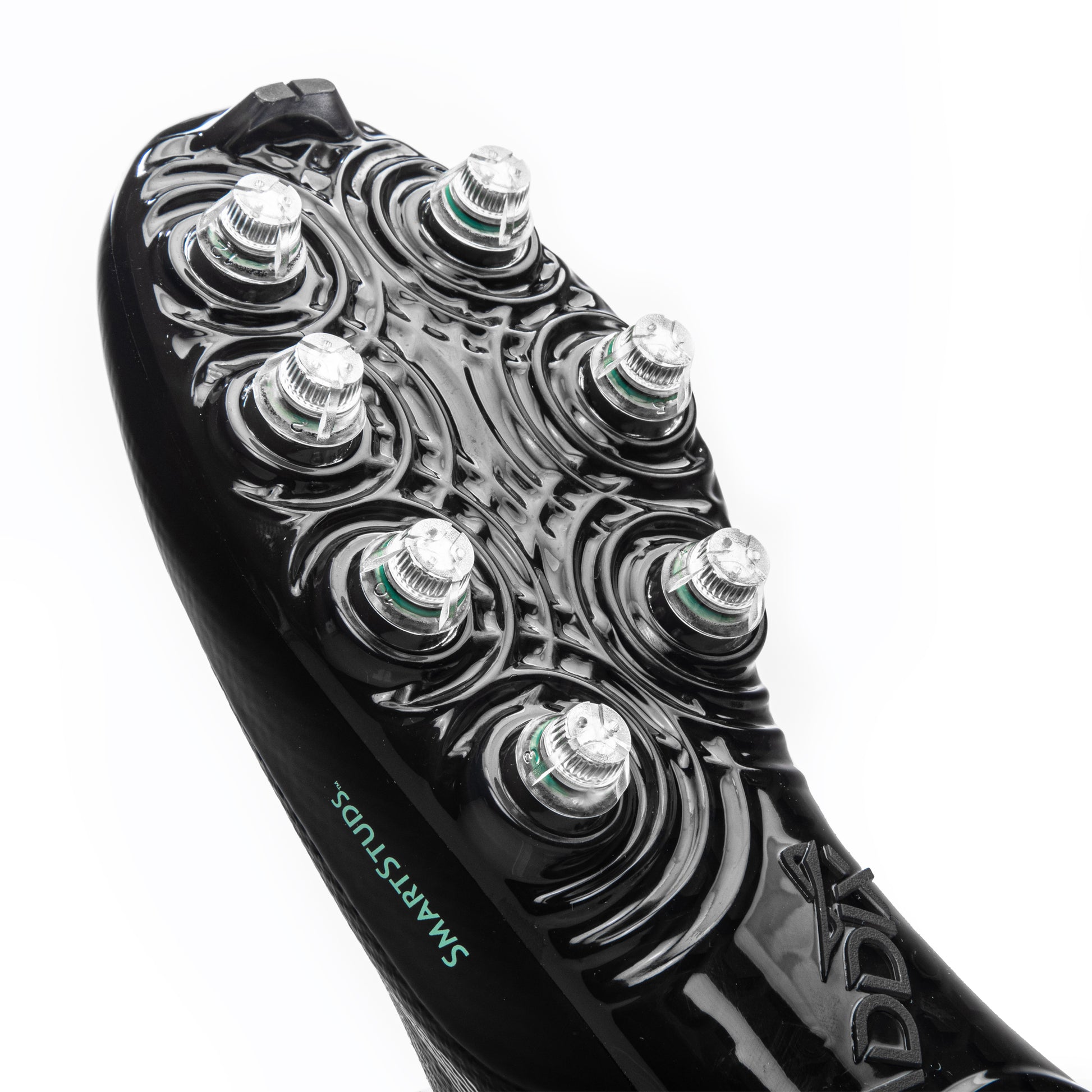 Detailed view of patented, injury-reducing Caddix Smart Studs on men’s low black/black football and lacrosse cleats.