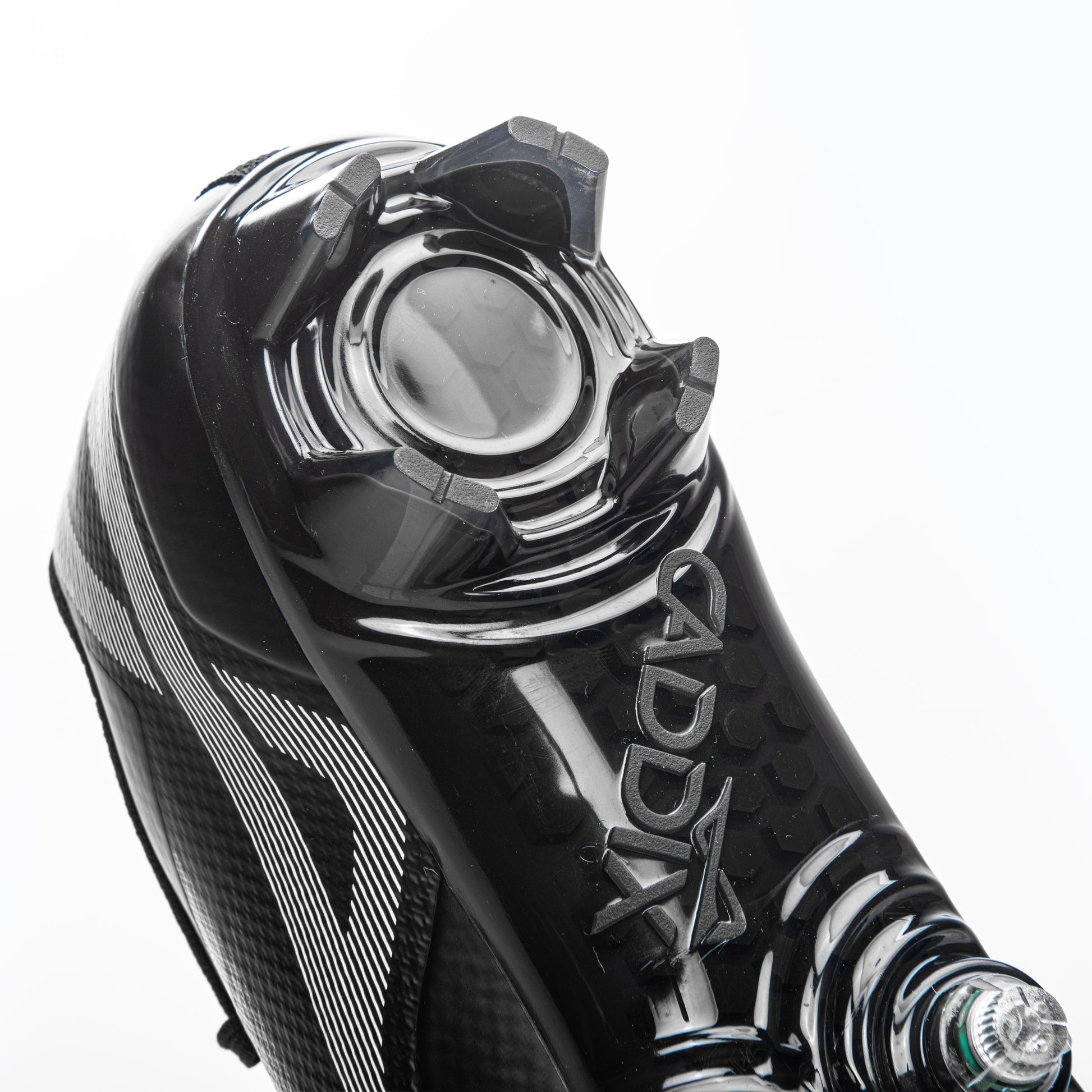 Close up of heel design on Caddix low black/black men’s football and lacrosse cleats. Up front, patented Smart Studs reduce torque that causes injury