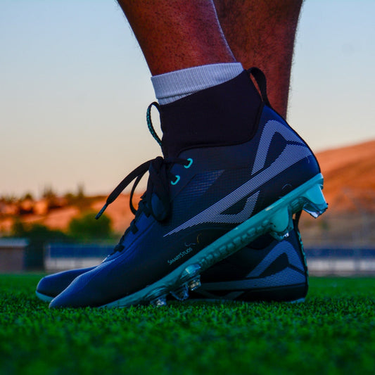 Caddix men's teals mid cut football lacrosse cleats for knee injuries in black teal